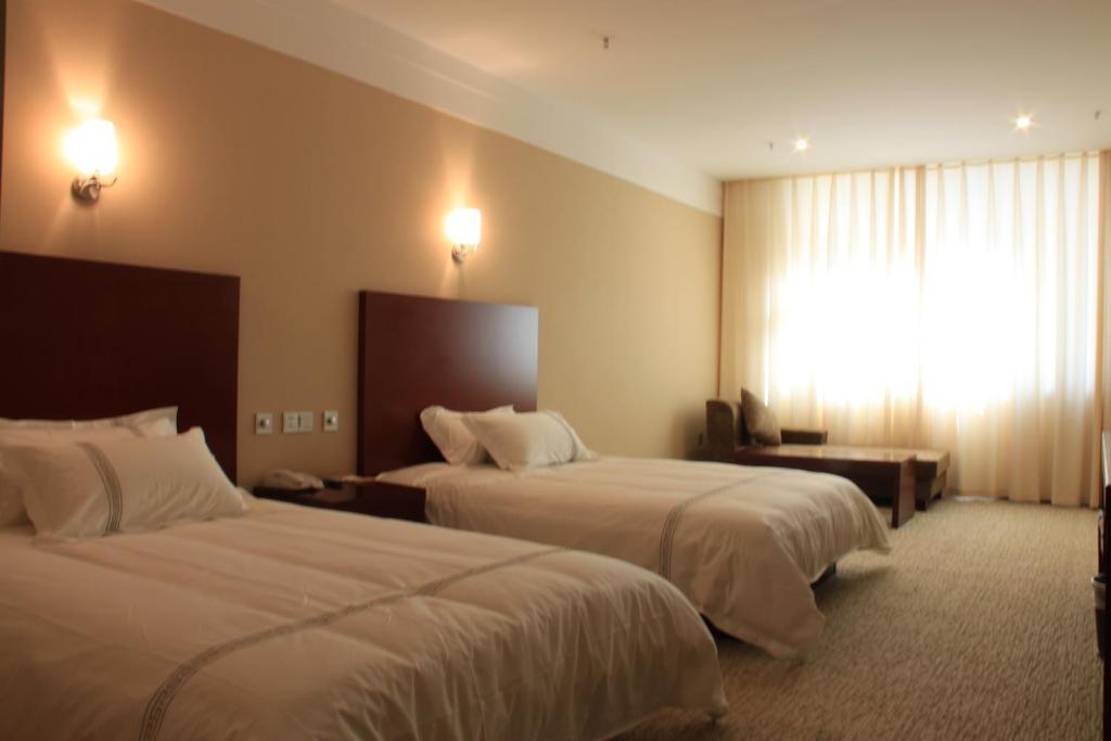 Zhou Wang Cheng Hotel Лоян Номер фото